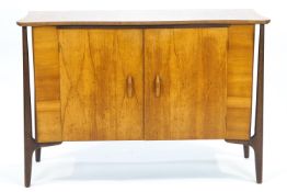 An Everest sideboard with two doors on tapering legs applied label,