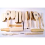 A mixed collection of 19th century and early 20th century ivory backed brushes together with ....