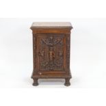 A 19th century profusely carved walnut side cupboard, the rectangular top with a gadrooned edge,