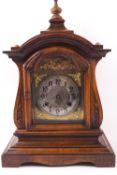 A walnut cased mantel clock,