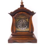 A walnut cased mantel clock,