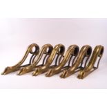 A set of five 19th century brass curtain brackets, each with an adjustable screw,