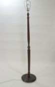 A hardwood standard lamp of ribbed baluster from,