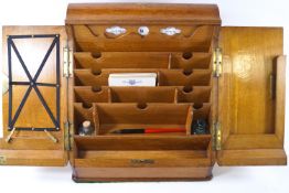 An early 20th century oak stationary box,