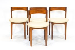 A teak dining set, comprising a round table,