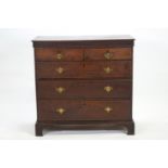 An oak chest of two short and three long drawers,