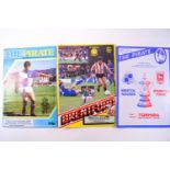 A box of football programmes,