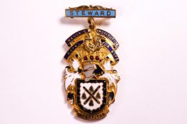 An unusual boys Masonic medal, by Garrard & Co, gilt and enamel,