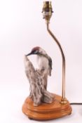 A Capodimonte Woodpecker '1983', on a lamp stand, signed and stamped (C) 1983 Florence,