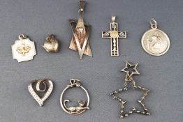 A selection of eight pendants of variable designs.