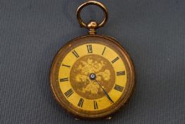 A yellow metal open face pocket watch. Key wound mechanical movement.