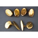 A collection of two pairs of yellow metal chain link cufflinks with engraved designs.