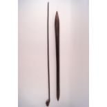 An African swagger stick the knop carved with a head,