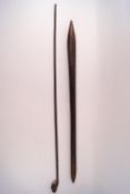 An African swagger stick the knop carved with a head,