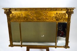 A Regency gilt over mantel three panel mirror of rectangular form,