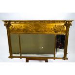 A Regency gilt over mantel three panel mirror of rectangular form,