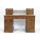 An oak Dickens style desk, the rectangular top with two end towers,