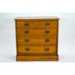 An oak chest of two short and three long drawers,