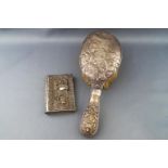 A handled hairbrush, profusely decorated with a hunting scene of the kill, Birmingham 1903,