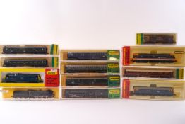 A collection of boxed Horny Minitrix N Gauge railway models