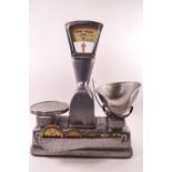 A set of cast white metal 4lb scales, by Vandome and Hart, numbered L3644,