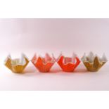 Four glass handkerchief bowls, decorated with white strips, two on yellow grounds,