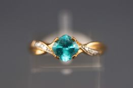 A yellow metal dress ring set with tourmaline (chipped) and single cut diamonds.