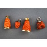 A selection of four carved coral charms having base metal fittings. Gross weight, 20.