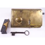 An extra large brass door lock and key,