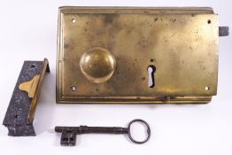 An extra large brass door lock and key,