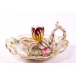A 19th century floral decorated chamber stick in the form of a scallop shell with loop handle,