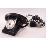 A French government issue black bakelite telephone handset, with extra listening ear piece,