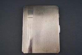 A silver cigarette case, of rectangular form with cut corners,