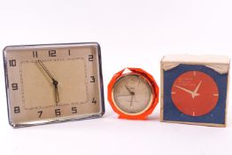 A clear Lucite cased 'Anvil Precision' Anvil clock,