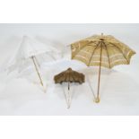A 19th century Broderie Anglais parasol with bone handle carved as chain linking,