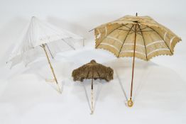 A 19th century Broderie Anglais parasol with bone handle carved as chain linking,