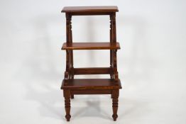 A 20th century set of three tier library steps on tuned tapering legs,