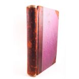 An 1860's Ledger book with leather spine and corners to maroon boards, apparently unused,