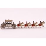 A die cast metal Coronation coach with eight horses and four out riders,