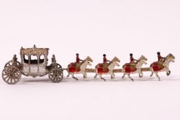 A die cast metal Coronation coach with eight horses and four out riders,