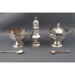 A silver three piece condiment set, of octagonal form, consisting of an open salt on pedestal foot,