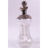 A rounded and nipped in swirl glass decanter with a pierced Rococo style neck