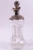 A rounded and nipped in swirl glass decanter with a pierced Rococo style neck