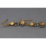 A yellow and white metal pair of drop earrings each set with oval faceted cut citrines and ....