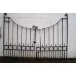 A pair of wrought iron black painted gates, 120cm high x 126cm wide (individual),