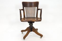 An oak swivel office/desk chair,