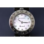A Bulgari B Zero1 watch having a diamond dot mother of pearl dial on green strap.