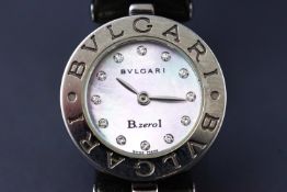 A Bulgari B Zero1 watch having a diamond dot mother of pearl dial on green strap.