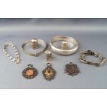 A selection of white metal jewellery items to include: Two bangles, a watch bracelet...