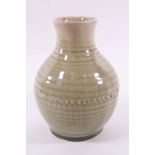 A Moorcroft vase with celadon glaze, impressed factory marks,